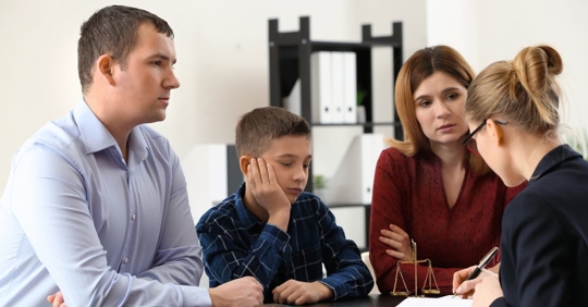 parents and child negotiating child support with lawyer