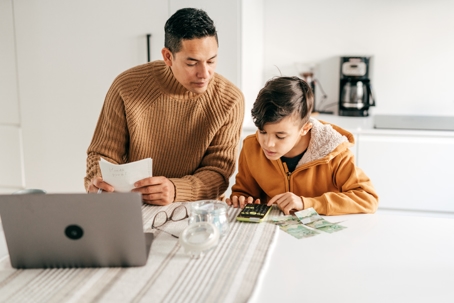 father and son counting money