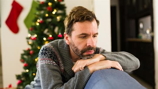 sad man at home during Christmas