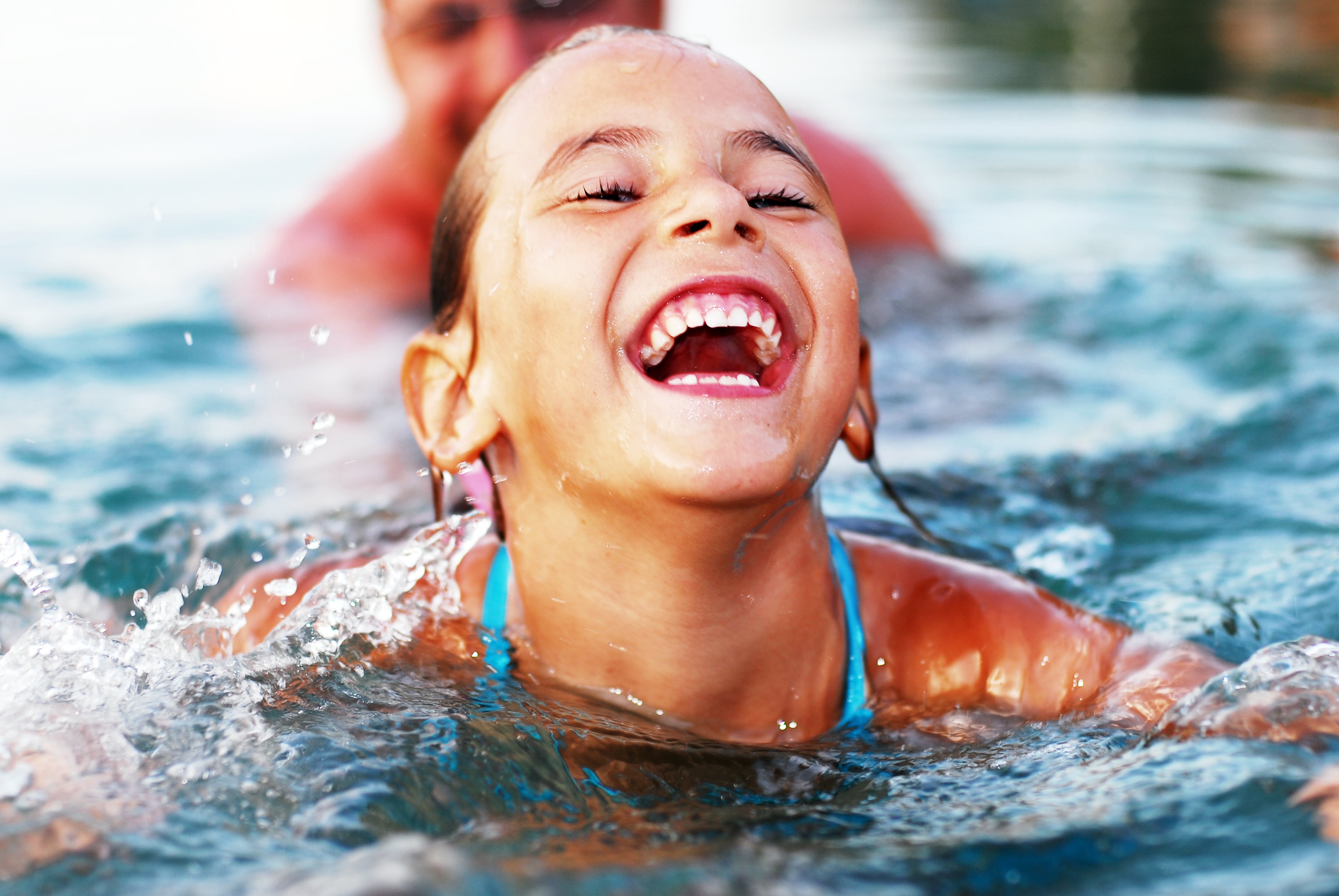 Child Swimming in a Pool 